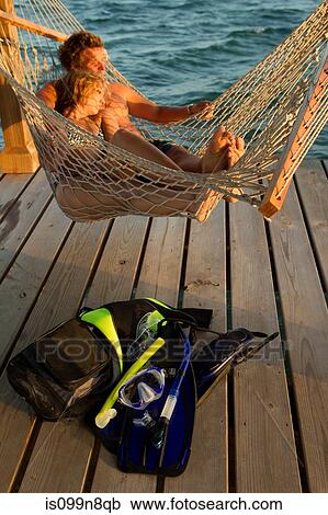 Stock Image - Relaxing in Hammock Post Snorkel. Fotosearch
