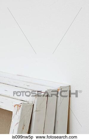 Stock Photography - Row of artist canvasses leaning in gallery. Fotosearch