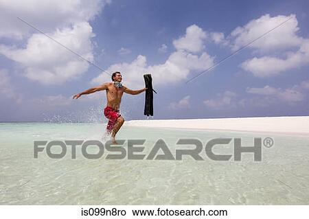 Running in Shallow Water View Large Photo Image Picture - Running in Shallow Water. Fotosearch