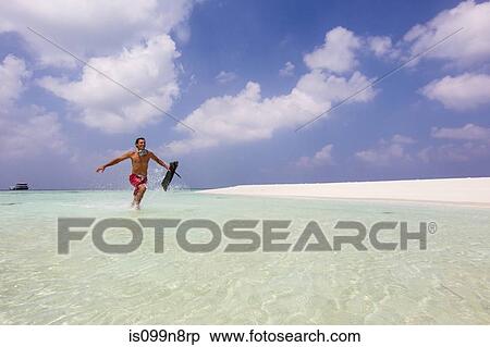 Running in Shallow Water View Large Photo Image Stock Photography - Running in Shallow Water. Fotosearch