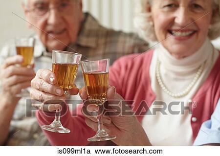 Senior adults having a toast View Large Photo Image Stock Image - Senior adults having a toast. Fotosearch