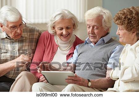 Senior adults using digital tablet View Large Photo Image Stock Image - Senior adults using digital tablet. Fotosearch