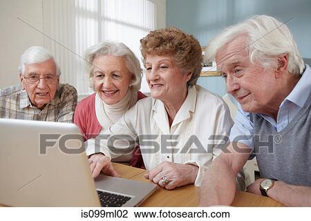 Senior adults using laptop View Large Photo Image Stock Image - Senior adults using laptop. Fotosearch
