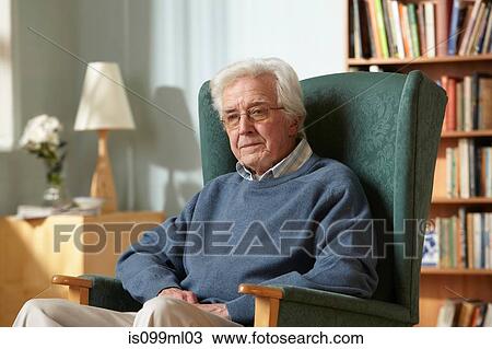 Senior man in armchair, portrait View Large Photo Image Stock Image - Senior man in armchair, portrait. Fotosearch