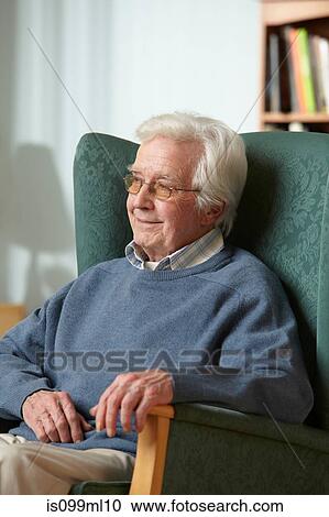 Senior man in armchair, portrait View Large Photo Image Stock Image - Senior man in armchair, portrait. Fotosearch
