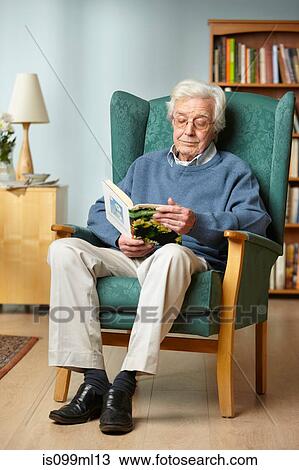 Senior man reading book View Large Photo Image Stock Image - Senior man reading book. Fotosearch
