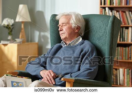 Senior man sleeping in armchair View Large Photo Image Stock Photo - Senior man sleeping in armchair. Fotosearch