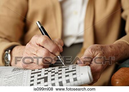 Senior woman doing crossword View Large Photo Image Stock Photo - Senior woman doing crossword. Fotosearch