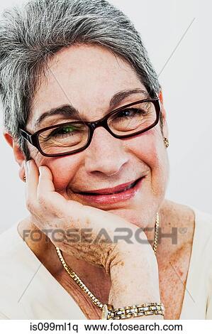 Senior woman wearing spectacles View Large Photo Image Stock Photography - Senior woman wearing spectacles. Fotosearch