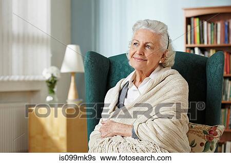 Senior woman wrapped in shawl, portrait View Large Photo Image Stock Photograph - Senior woman wrapped in shawl, portrait. Fotosearch