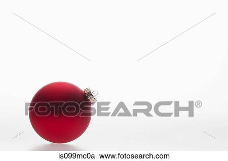 Stock Image - Single red bauble. Fotosearch