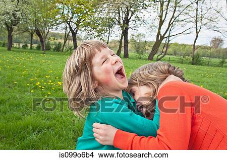 Sister playfighting View Large Photo Image Picture - Sister playfighting. Fotosearch