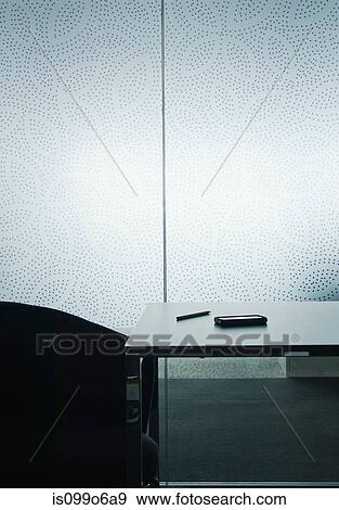 Smartphone on table in empty room View Large Photo Image Stock Photo - Smartphone on table in empty room. Fotosearch
