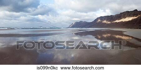 Stock Image - Still water of Famara beach, Canary Islands, Spain. Fotosearch