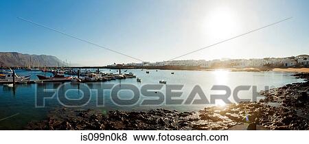 Sunlit harbour in La Gracioca, Lanzarote, Spain View Large Photo Image Stock Photo - Sunlit harbour in La Gracioca, Lanzarote, Spain. Fotosearch