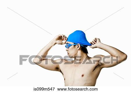 Swimmer putting on swimming cap View Large Photo Image Stock Photo - Swimmer putting on swimming cap. Fotosearch
