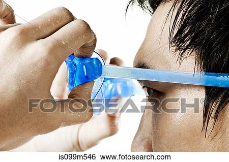 Swimmer putting on swimming goggles View Large Photo Image Stock Photograph - Swimmer putting on swimming goggles. Fotosearch
