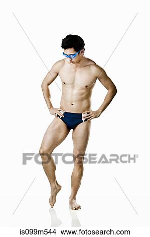 Swimmer wearing swimming trunks View Large Photo Image Picture - Swimmer wearing swimming trunks. Fotosearch
