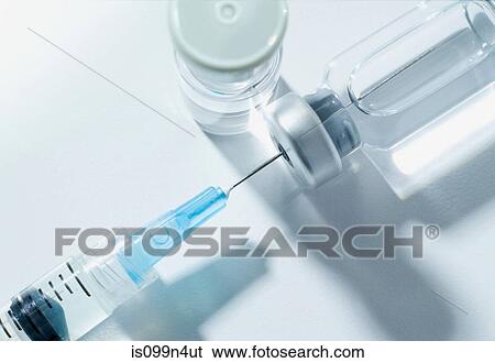 Syringe and vials, studio shot View Large Photo Image Stock Photograph - Syringe and vials, studio shot. Fotosearch