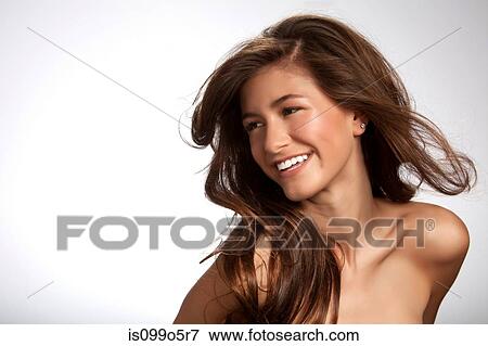 Teenage girl smiling against white background View Large Photo Image Stock Photo - Teenage girl smiling against white background. Fotosearch