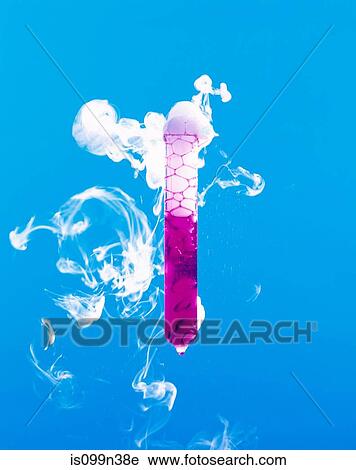 Stock Image - Test tube with steaming pink liquid. Fotosearch