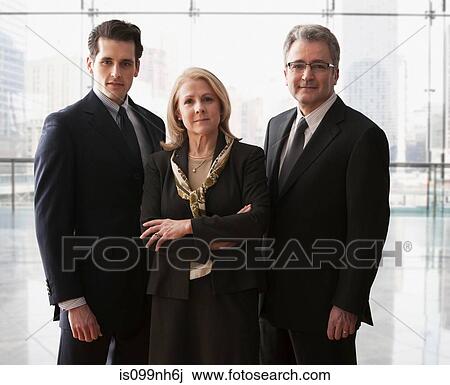 Three business colleagues standing together, portrait View Large Photo Image Stock Image - Three business colleagues standing together, portrait. Fotosearch