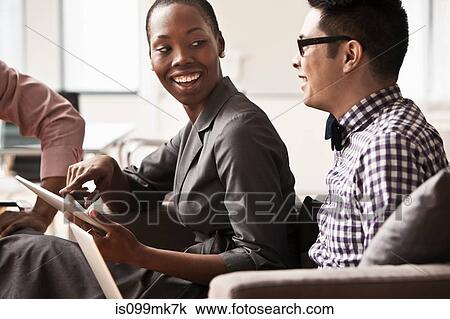 Three business people in meeting View Large Photo Image Stock Image - Three business people in meeting. Fotosearch