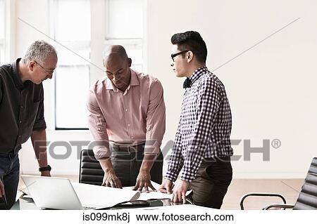 Three business people in meeting View Large Photo Image Stock Image - Three business people in meeting. Fotosearch