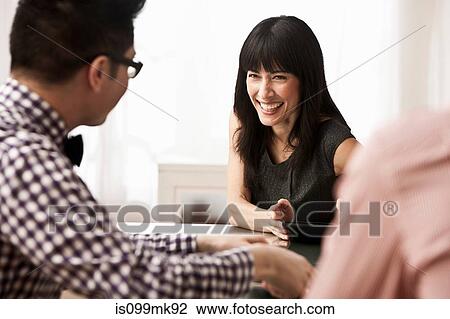 Three business people in meeting View Large Photo Image Stock Image - Three business people in meeting. Fotosearch