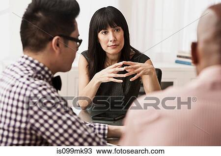 Three business people in meeting View Large Photo Image Stock Image - Three business people in meeting. Fotosearch