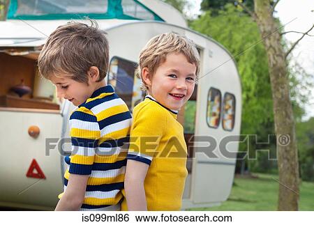 Two boys outside caravan, portrait View Large Photo Image Stock Photograph - Two boys outside caravan, portrait. Fotosearch