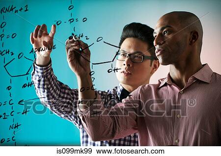 Two people writing formula on window View Large Photo Image Stock Photo - Two people writing formula on window. Fotosearch