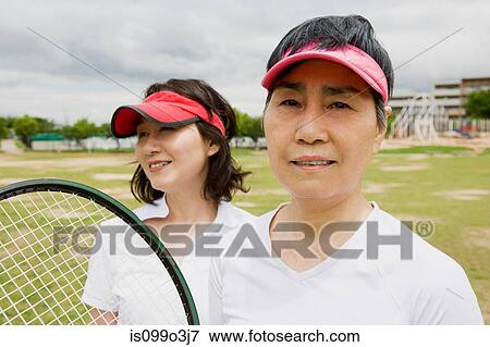 Two women ready for tennis View Large Photo Image Stock Photo - Two women ready for tennis. Fotosearch