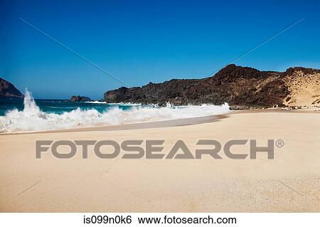 Waves against shore of beach, La Gracioca, Lanzarote, Spain View Large Photo Image Stock Photograph - Waves against shore of beach, La Gracioca, Lanzarote, Spain. Fotosearch