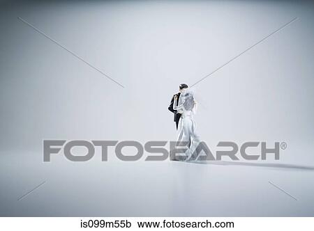 Stock Image - Wedding cake figurines, studio shot. Fotosearch