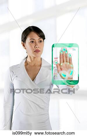 Woman holding hand up to recognition screen View Large Photo Image Stock Photo - Woman holding hand up to recognition screen. Fotosearch
