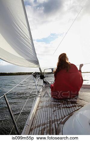 Woman sitting on bow of yacht View Large Photo Image Stock Photography - Woman sitting on bow of yacht. Fotosearch