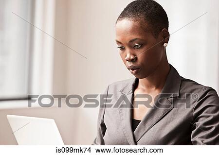 Young businesswoman working View Large Photo Image Picture - Young businesswoman working. Fotosearch