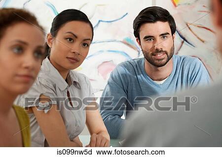 Young man and women in discussion in gallery View Large Photo Image Stock Image - Young man and women in discussion in gallery. Fotosearch