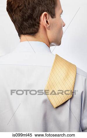 Young man with tie over shoulder View Large Photo Image Stock Photography - Young man with tie over shoulder. Fotosearch
