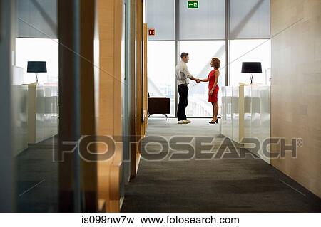 Young woman and man meeting in office View Large Photo Image Stock Photo - Young woman and man meeting in office. Fotosearch