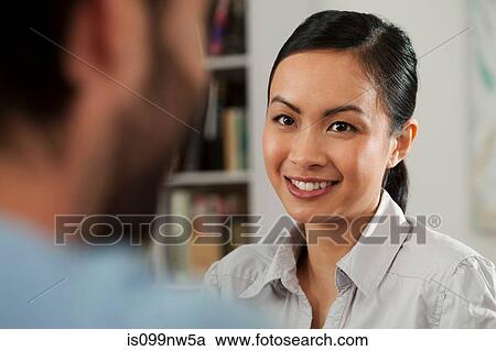 Young woman and smiling in gallery View Large Photo Image Stock Image - Young woman and smiling in gallery. Fotosearch