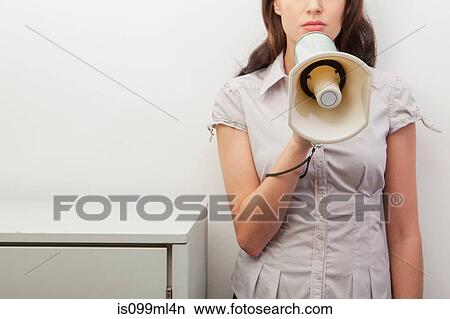 Young woman holding megaphone View Large Photo Image Picture - Young woman holding megaphone. Fotosearch