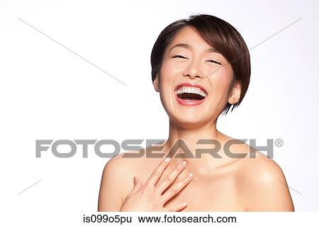 Young woman laughing against white background View Large Photo Image Stock Photograph - Young woman laughing against white background. Fotosearch