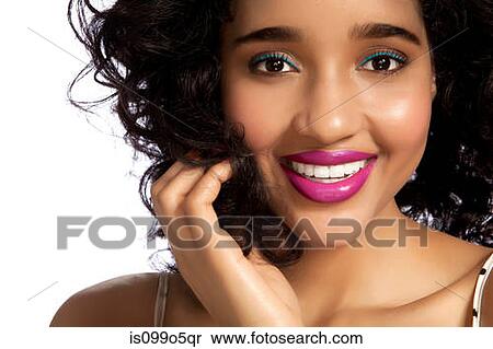Stock Photography - Young woman smiling against white background. Fotosearch