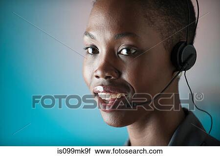 Young woman wearing telephone headset View Large Photo Image Stock Image - Young woman wearing telephone headset. Fotosearch