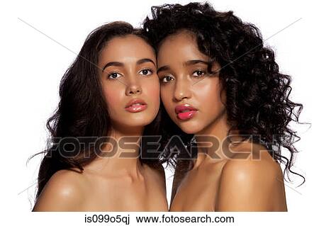 Stock Image - Young women together against white background. Fotosearch