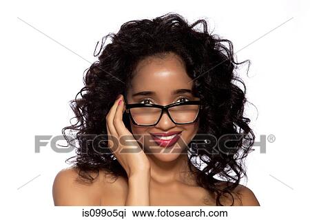 Stock Image - Young women wearing spectacles against white background. Fotosearch