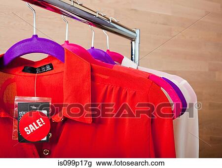 Blouses in sale on clothes rail View Large Photo Image Stock Image - Blouses in sale on clothes rail. Fotosearch