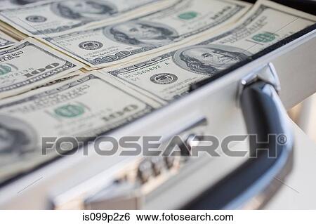 Stock Photograph - Briefcase with 100 dollar banknotes. Fotosearch